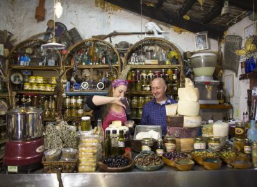 Galilee is a large region in northern Israel which is t raditionally divided into Upper Galilee, Lower Galilee and Western Galilee . The picture shows a renowned cheesemaker in his shop. Schwartzman at Bat Shlomo. Photo by Itamar Grinberg.
